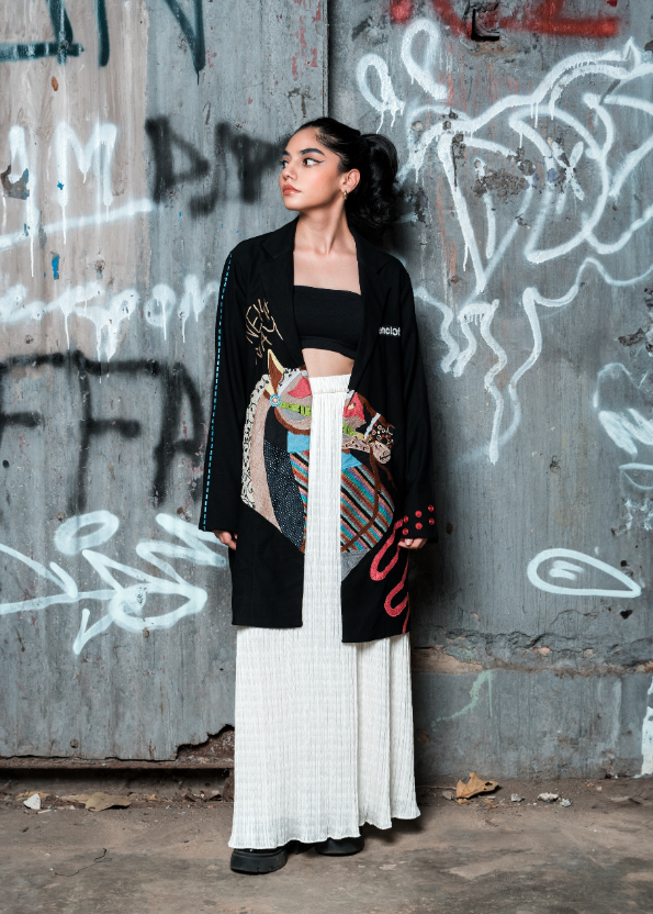 Woman standing in front of a graffiti-covered wall
