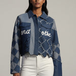 Woman wearing a blue patterned jacket with text on a gray background