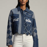 Woman wearing a blue patterned jacket with text on a gray background