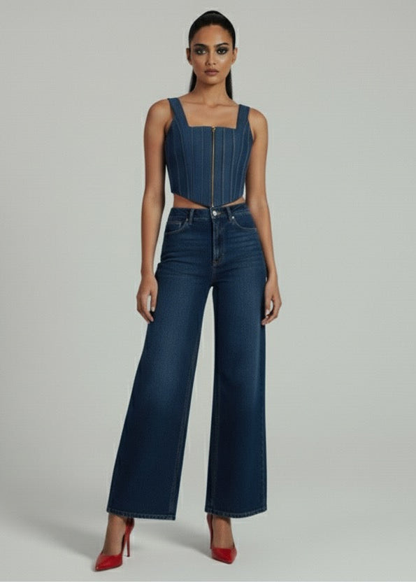 Woman wearing a denim outfit on a gray background