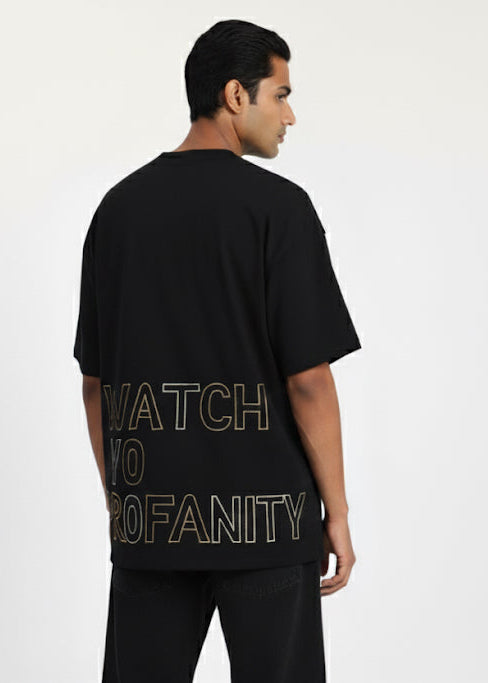 Man wearing a black t-shirt with text on the back against a white background