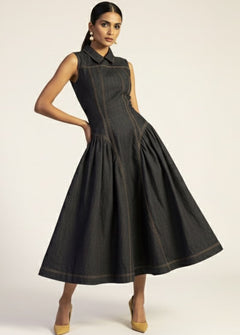 Woman wearing a black sleeveless dress on a white background