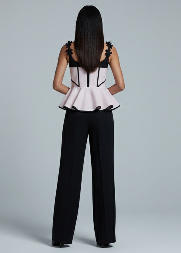 Woman wearing a black and white outfit on a gray background