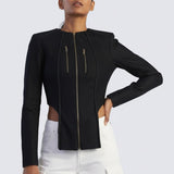Woman wearing a black jacket with cut-out design on a white background