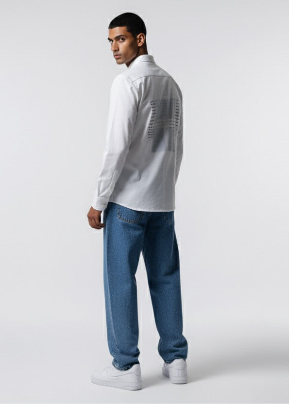 Man wearing a white shirt and blue jeans on a white background