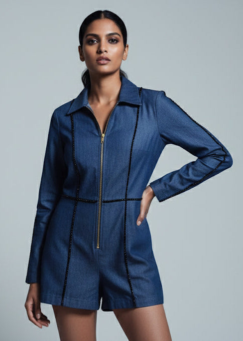 Woman wearing a blue jacket against a gray background