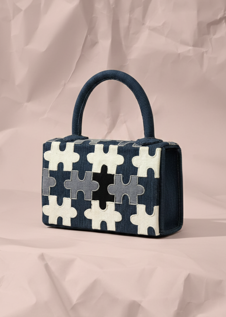 Handbag with puzzle pattern on a beige background